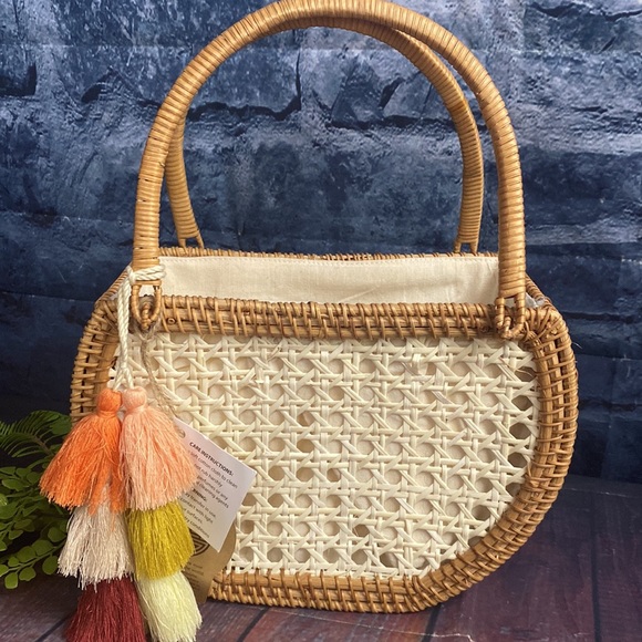 Crescent Woven Handbag with tassel detail and cinch bag interior - Picture 2 of 11